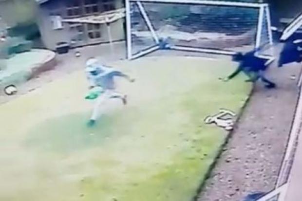 CCTV: Offenders exit through a separate window carrying a green bag