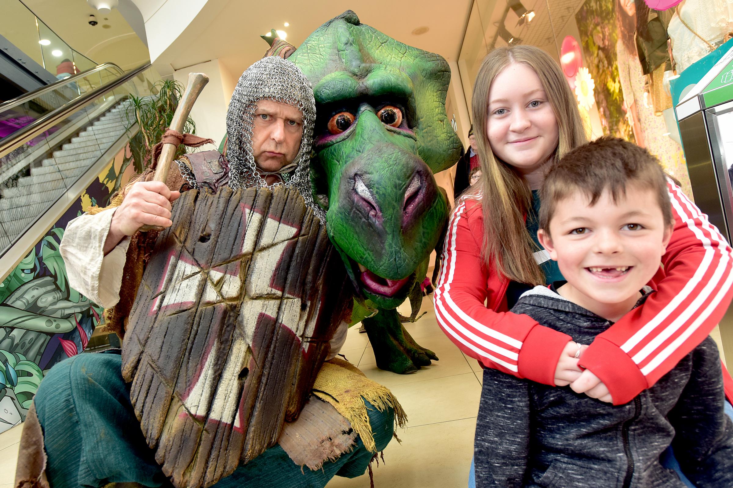 Fire-breathing animatronic dragon delights children at shopping centre