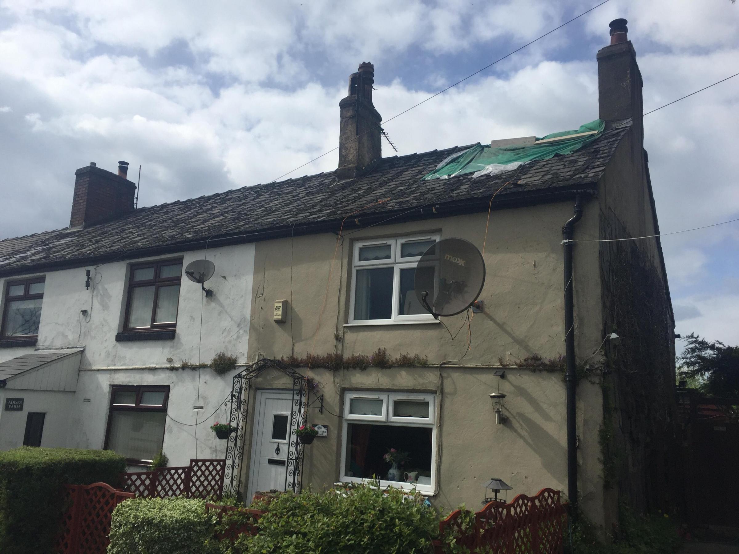 Your roof is on fire, passer-by tells couple sitting in front of open fire